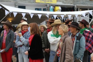 Cowpokes taking a keen interest in the spin of the wheel 